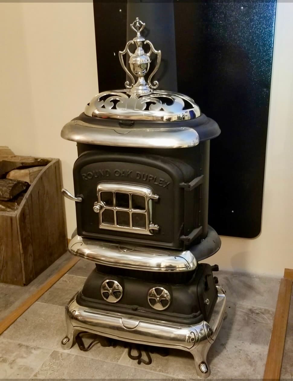 Fully restored antique Round Oak Duplex cast iron parlor stove with polished nickel trim